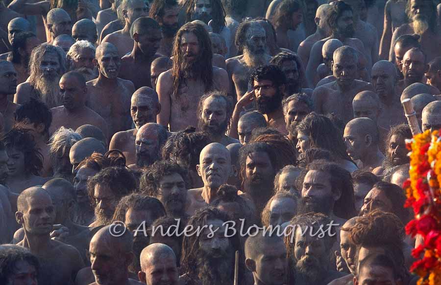  White sadhu in an ash smeared crowd 
